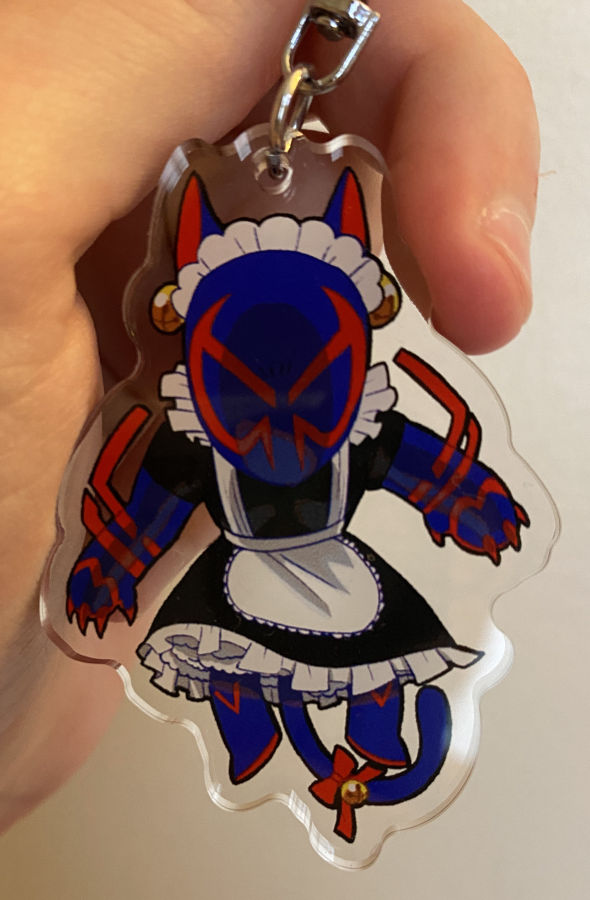 An acrylic charm of Miguel O'Hara with cat ears, claws, and a tail wearing a maid outfit.