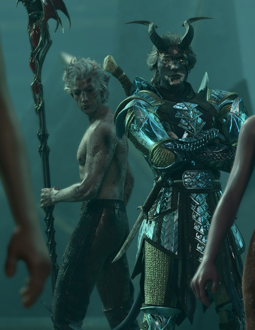 Tav standing with his arm crossed next to Astarion. Astarion is a white elf who is shirtless.